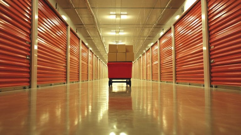 Boxes on cart in storage facility hallway